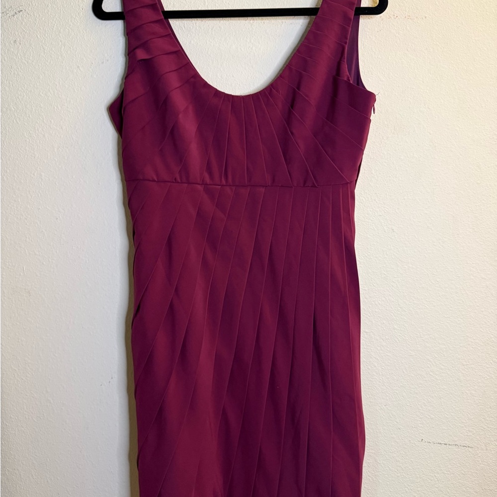 Elegant plum cocktail dress, pleated detail, perfect for special occasions.